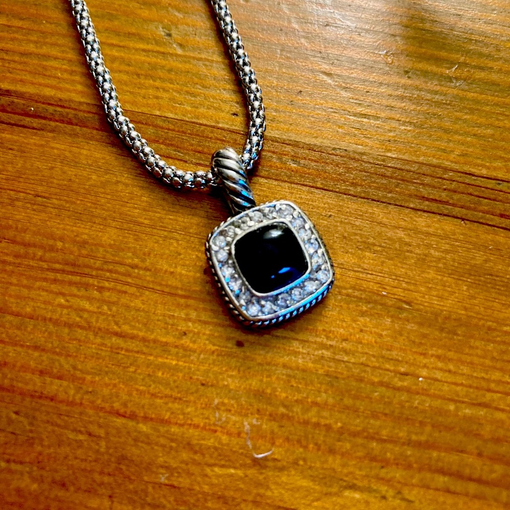 Silver necklace with black center